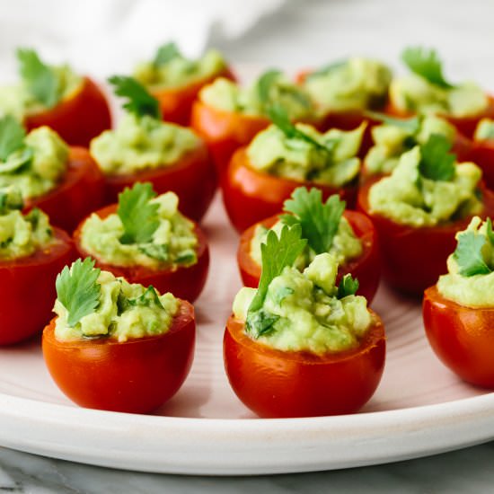 Guacamole Stuffed Tomatoes - Recipe photo by Downshiftology