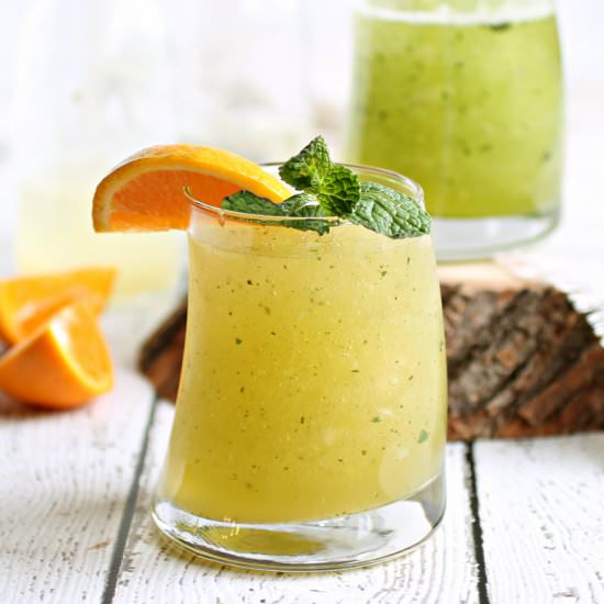 Tangerine Mint Whiskey Slush - Recipe photo by Hungry Couple