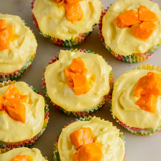 Coconut Mango Cupcakes - Recipe photo by The Desserted Girl