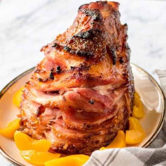 Peach Glazed Spiral Ham - Recipe photo by noshingwiththenolands