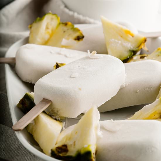 Pina Coloda Popsicles - Recipe photo by TheDeliciousSpoon