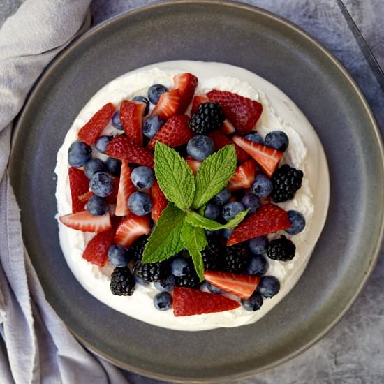Pavlova With Mixed Berries - Recipe photo by simmerandsauce