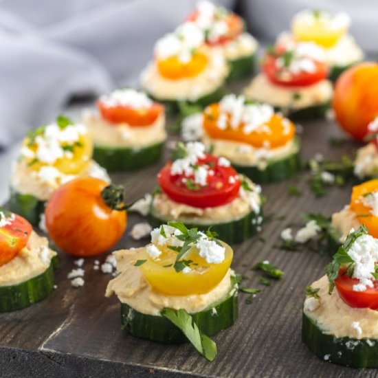 Cucumber Hummus Bites - Recipe photo by noshingwiththenolands
