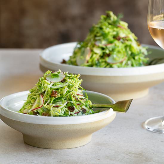 brussels sprout slaw with raisins - Recipe photo by between2kitchens
