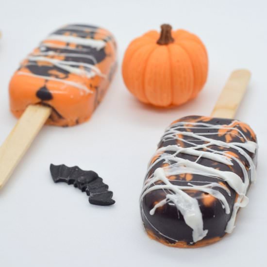 Spiderweb marbled orange cakesicles - Recipe photo by Sweet Mouth Joy