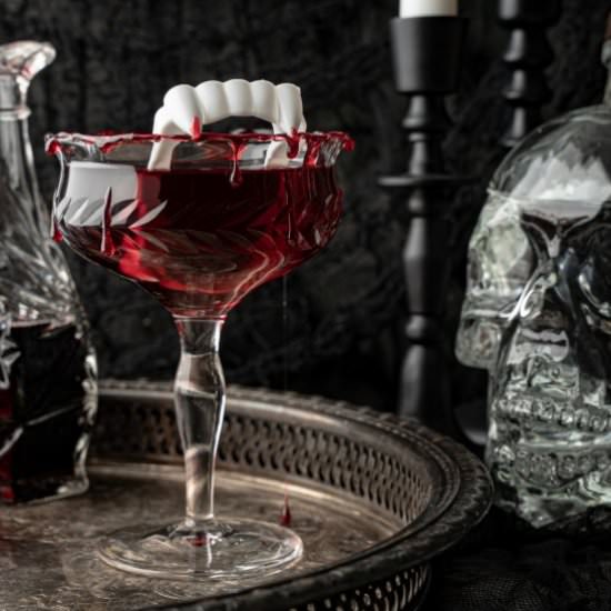 Dracula's Kiss Halloween Cocktail - Recipe photo by noshingwiththenolands
