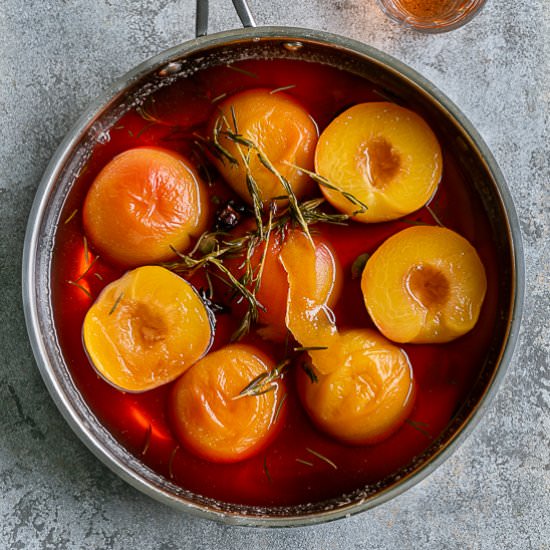 Poached Peaches with Wine - Recipe photo by between2kitchens