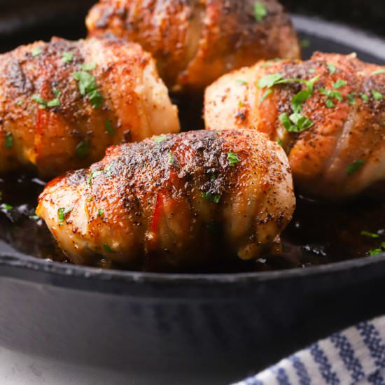 Bacon Wrapped Chicken Thighs - Recipe photo by Grits and Pinecones
