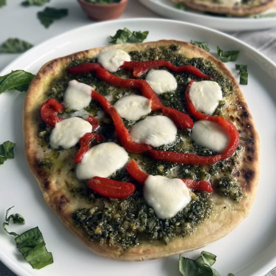 Naan Pesto Pizzas - Recipe photo by the_wellness_walnut
