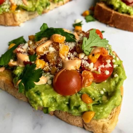 Avocado Toast w/Tomatoes and Corn - Recipe photo by Nosh Nourish Wander