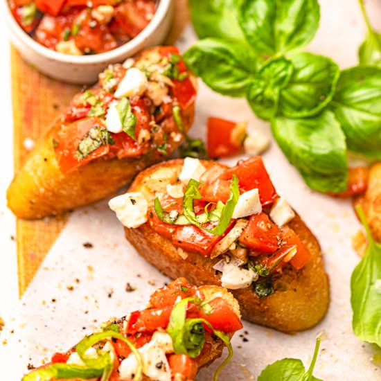Bruschetta with Mozzarella - Recipe photo by BritneyBreaksBread