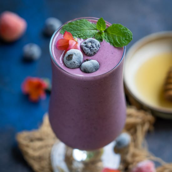 Triple Berry Oat Tropical Smoothie - Recipe photo by Whiskaffair
