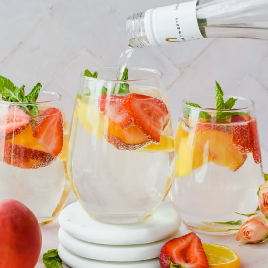 Sparkling Peach Sangria - Recipe photo by apaigeofpositivity