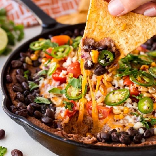Warm Rustic Black Bean Dip - Recipe photo by noshingwiththenolands