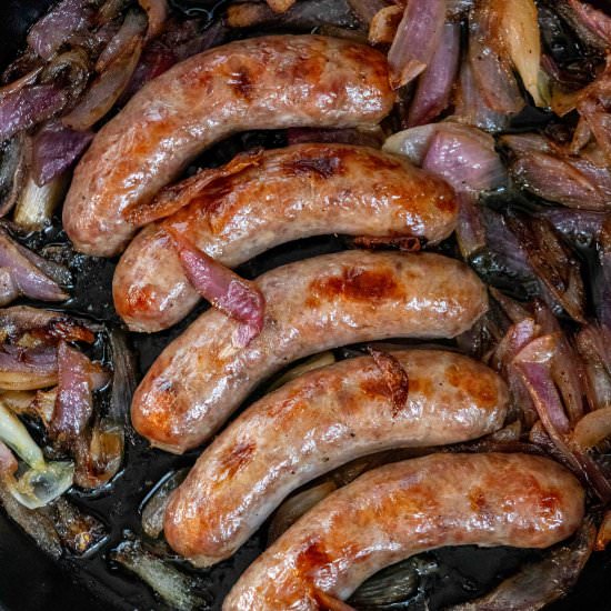 Oven Baked Bratwurst and Onions - Recipe photo by JawnsICooked