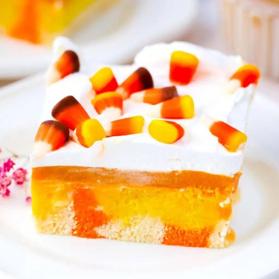 Candy Corn Poke Cake - Recipe photo by peasandpeonies