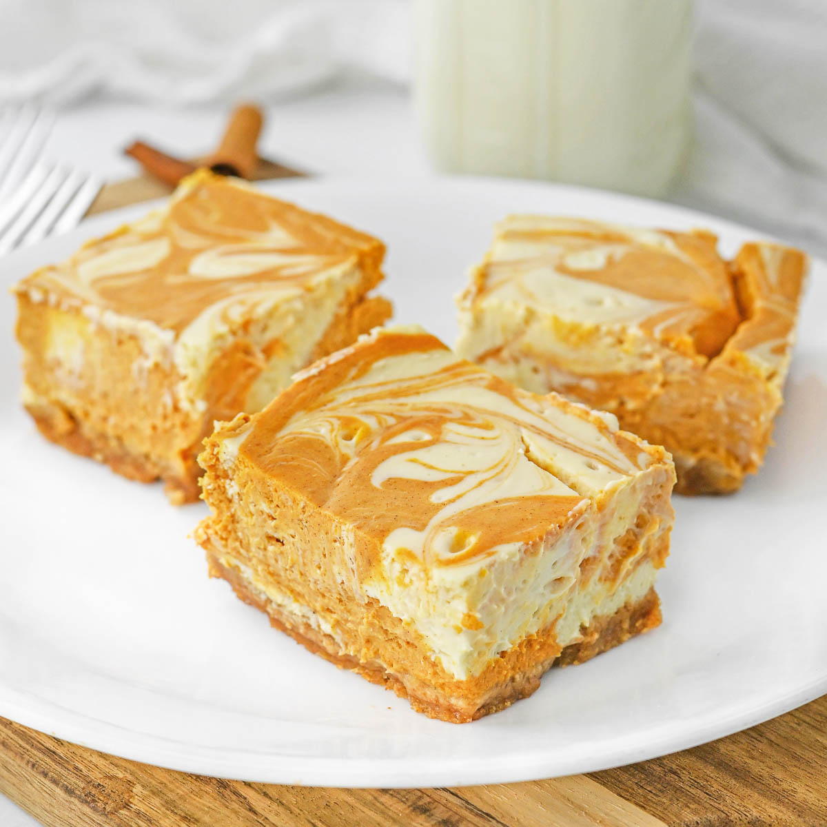 Pumpkin Swirl Cheesecake Bars - Recipe photo by ToSimplyInspire