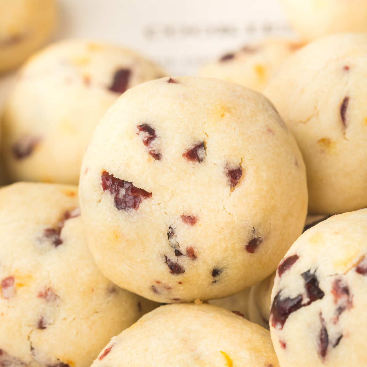 Cranberry Orange Christmas Sandies - Recipe photo by Love Bakes Good Cakes