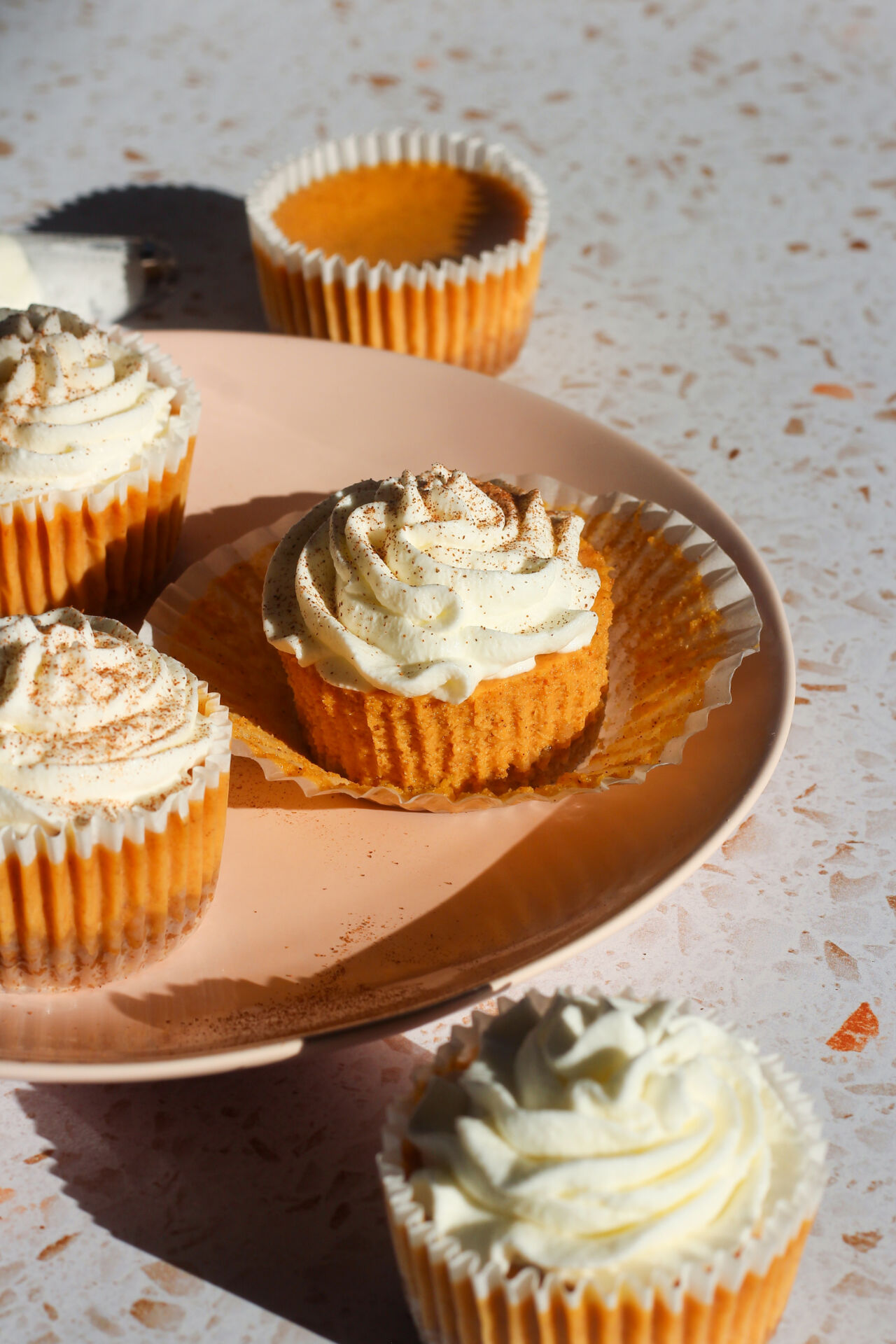 Mini Pumpkin Cheesecakes - Recipe photo by schmidtybakes