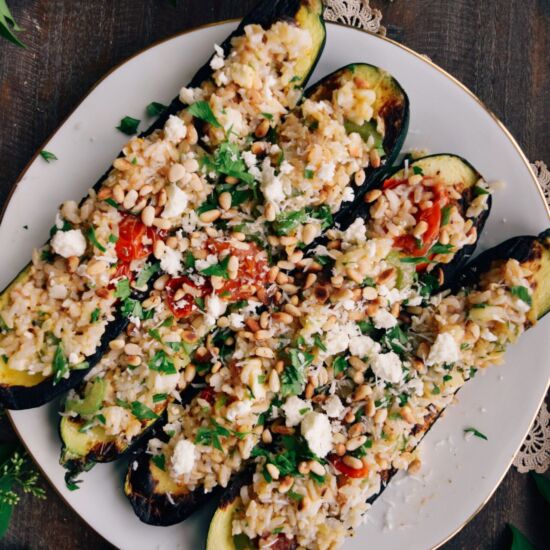 Zucchini Boats with Pignoli & Feta - Recipe photo by LivingtheGourmet