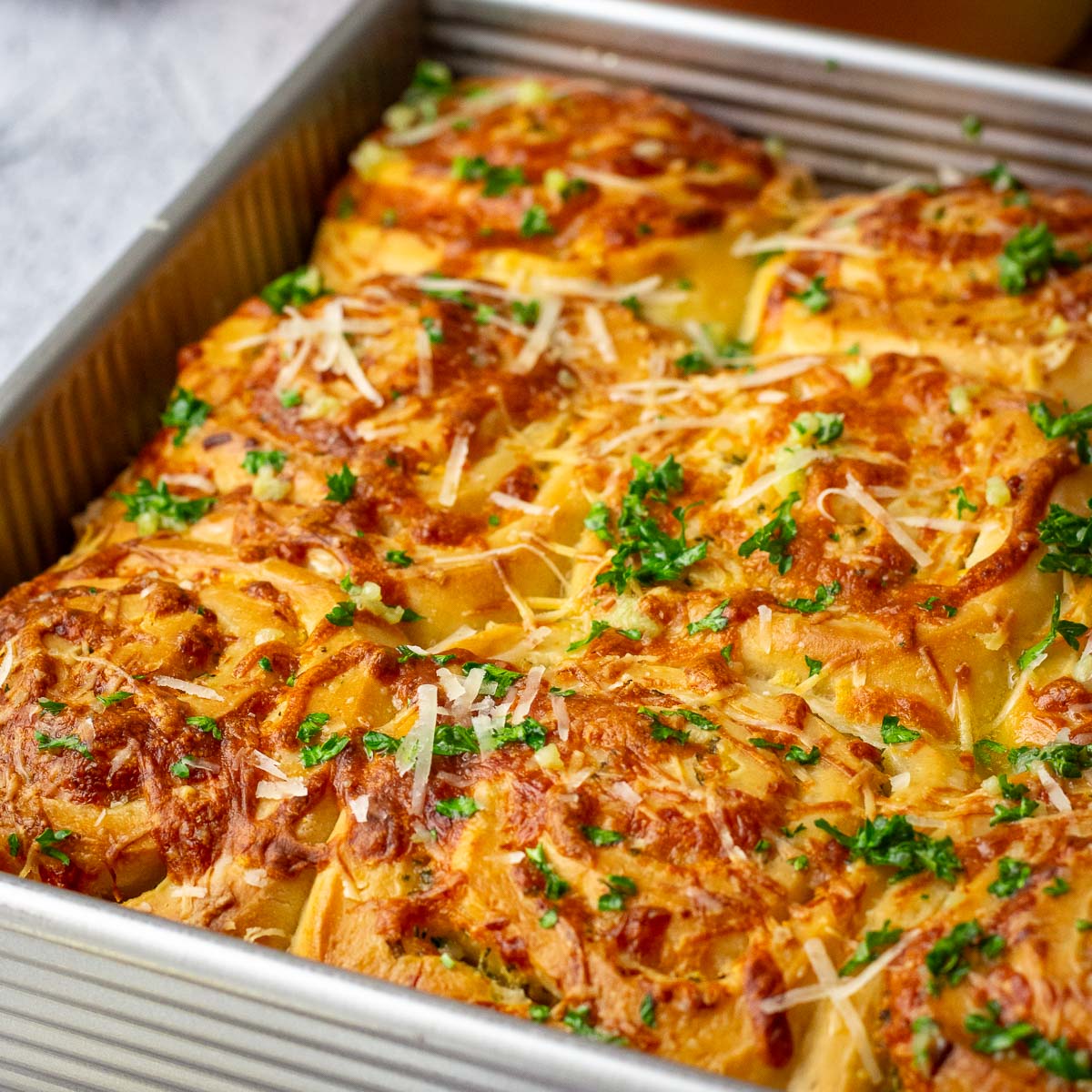 Cheesy Sourdough Garlic Rolls - Recipe photo by somebodyfeedseb