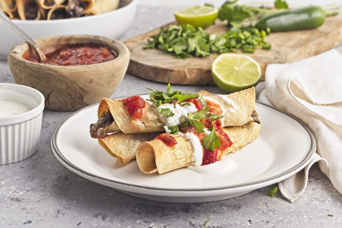Crispy Bean and Cheese Taquitos - Recipe photo by ATasteforTravel