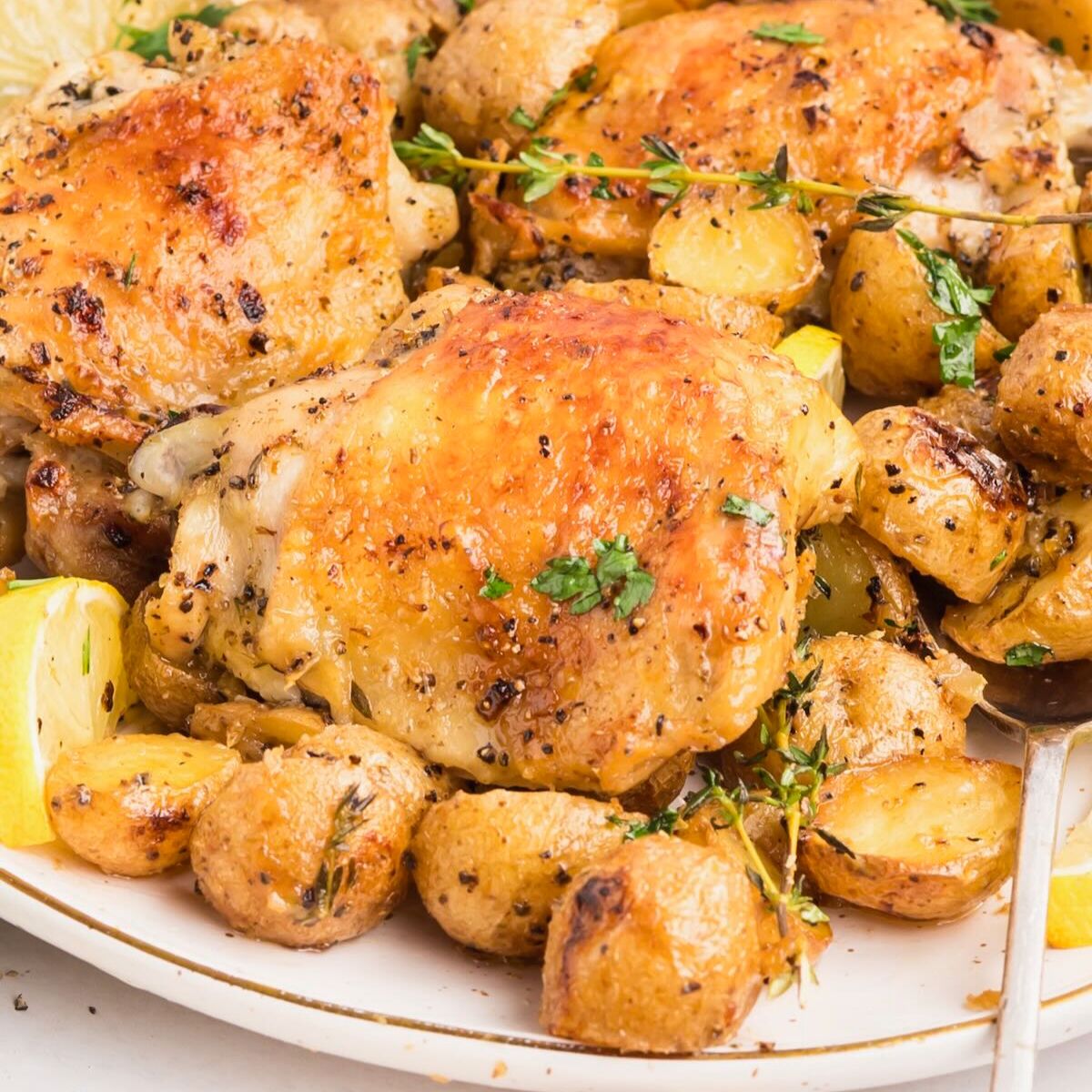 Baked Chicken Thighs and Potatoes - Recipe photo by Grits and Pinecones